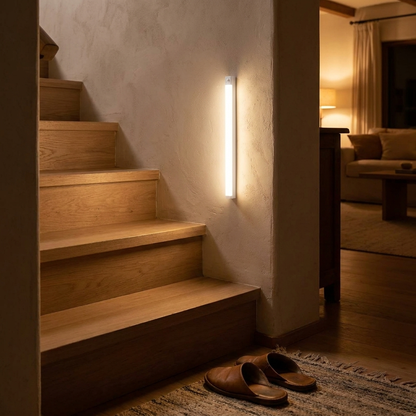 Motion sensor night light mounted in a hallway