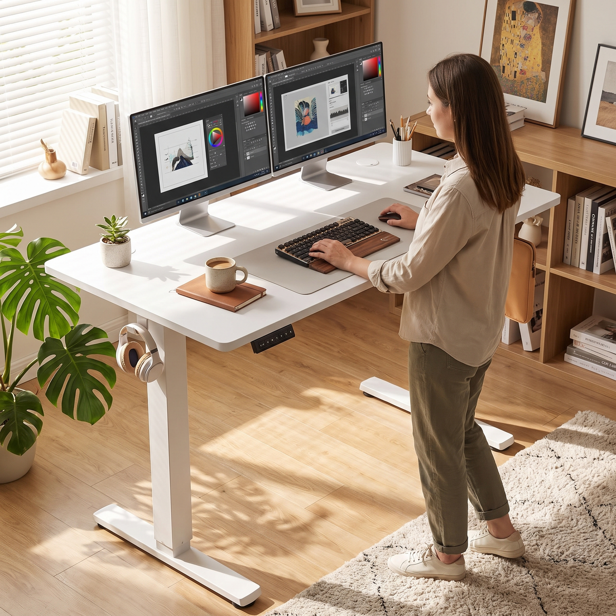 Electric standing desk in white, raised to standing height in a home office