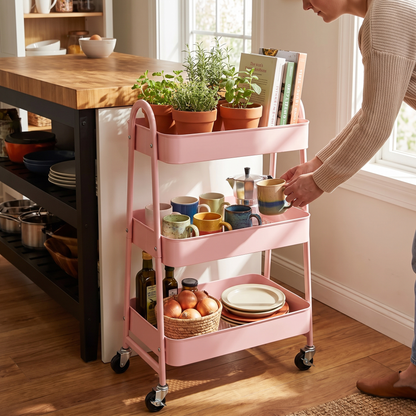 3 tier pink rolling storage cart in use in a kitchen
