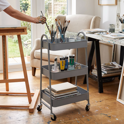 3 tier gray rolling utility cart in use in a kitchen