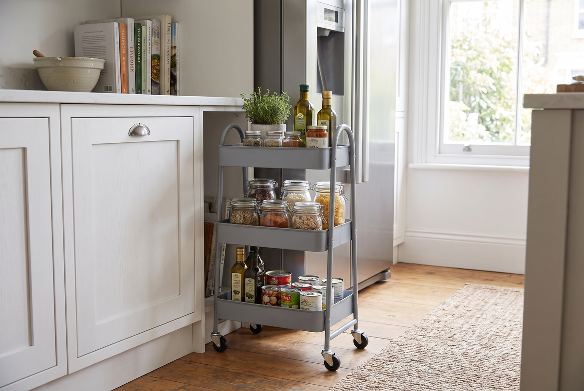 3 tier gray metal rolling storage cart in a kitchen, lifestyle photo 1