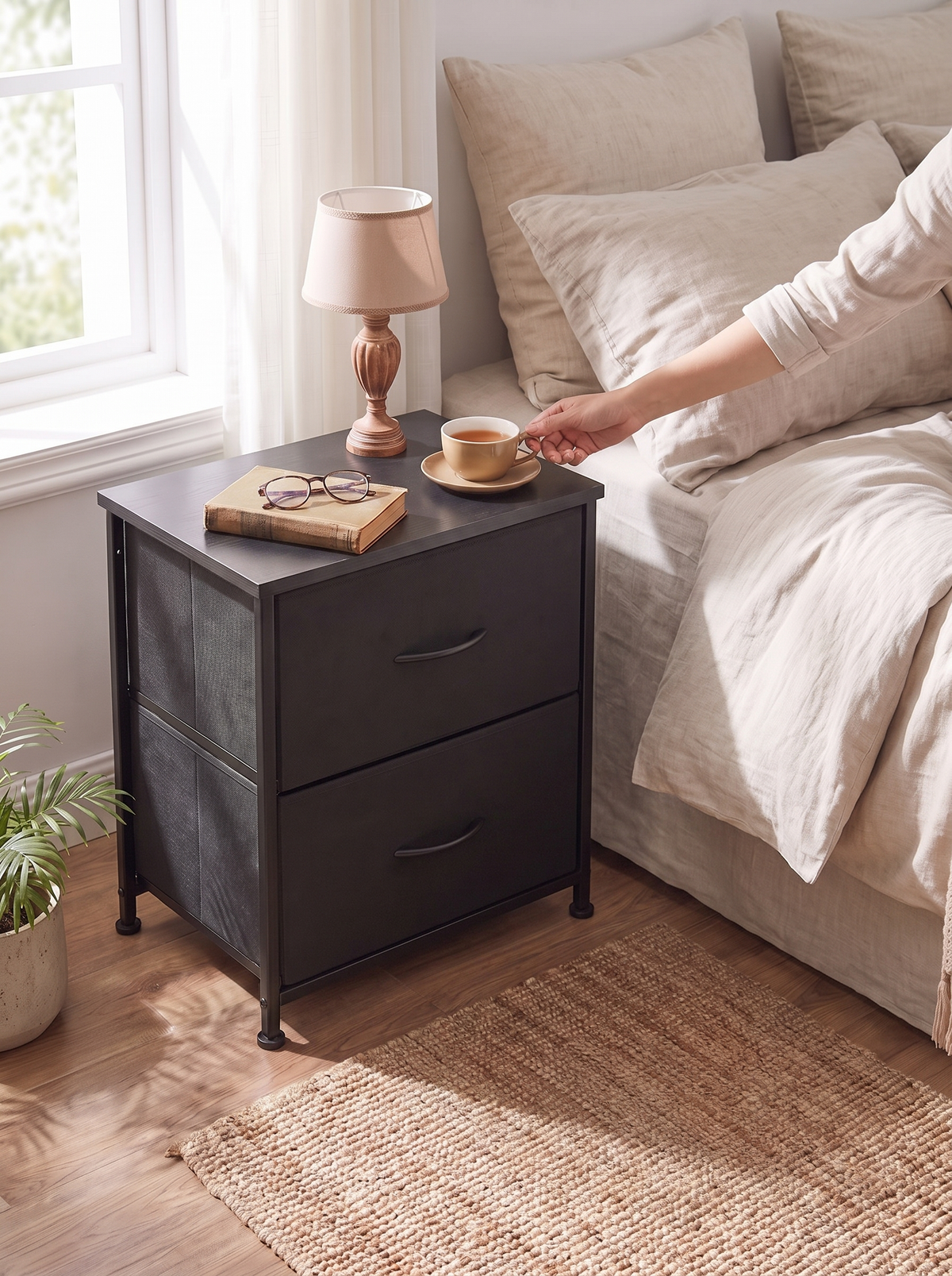 Compact black 2 drawer nightstand with wooden top beside a bed in a small bedroom