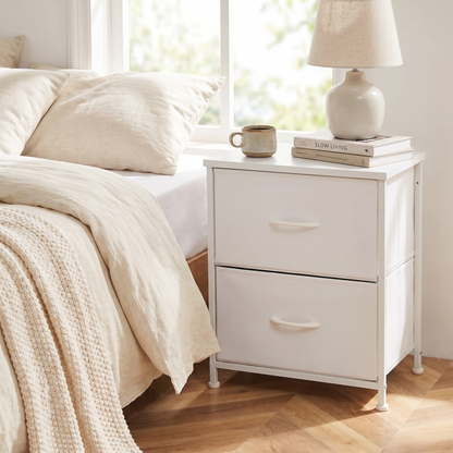 White 2-drawer fabric nightstand styled beside a bed