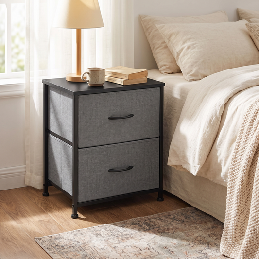 Gray 2-drawer fabric nightstand with black top and black steel frame styled beside a bed