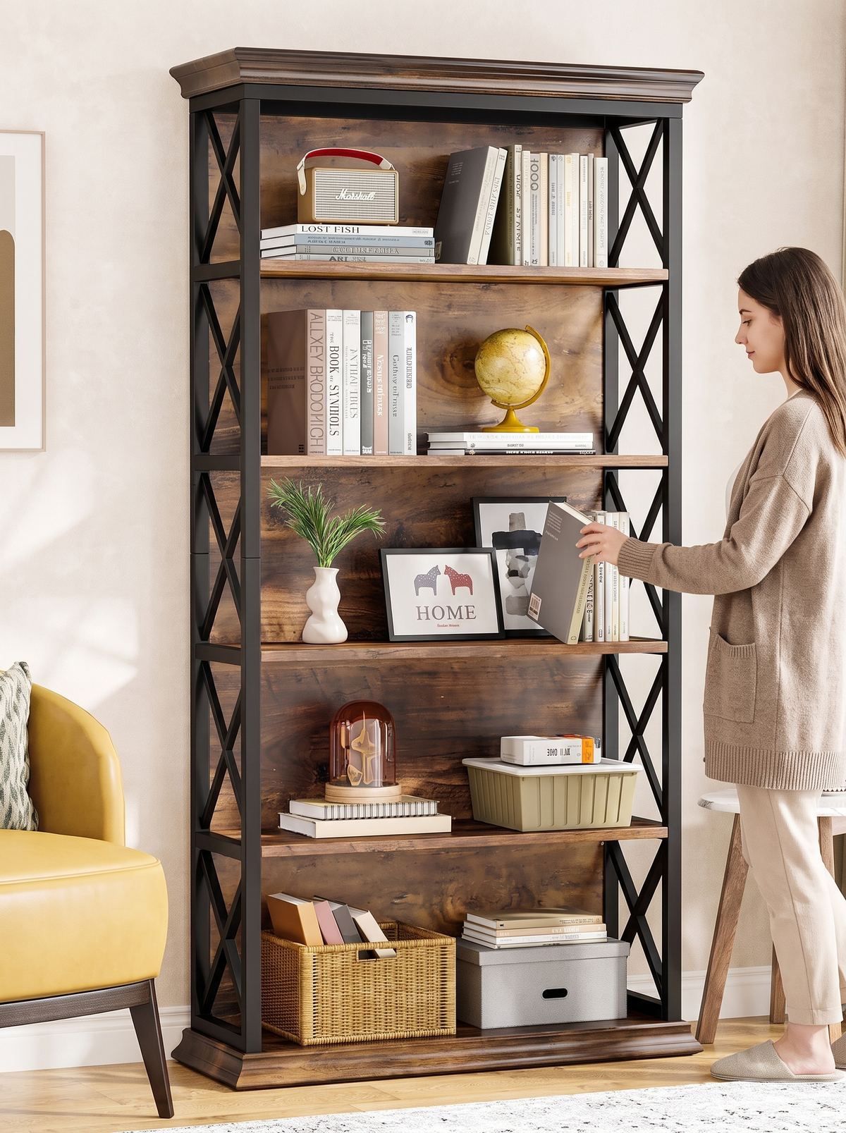 Brown wood and black steel X frame bookcase styled with books and decor in a warm living room