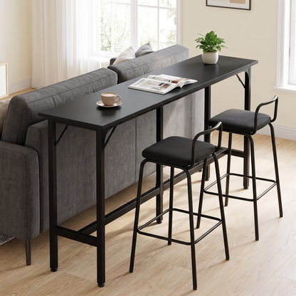 All-black long narrow bar-height console table with stools behind a sofa in a modern living room